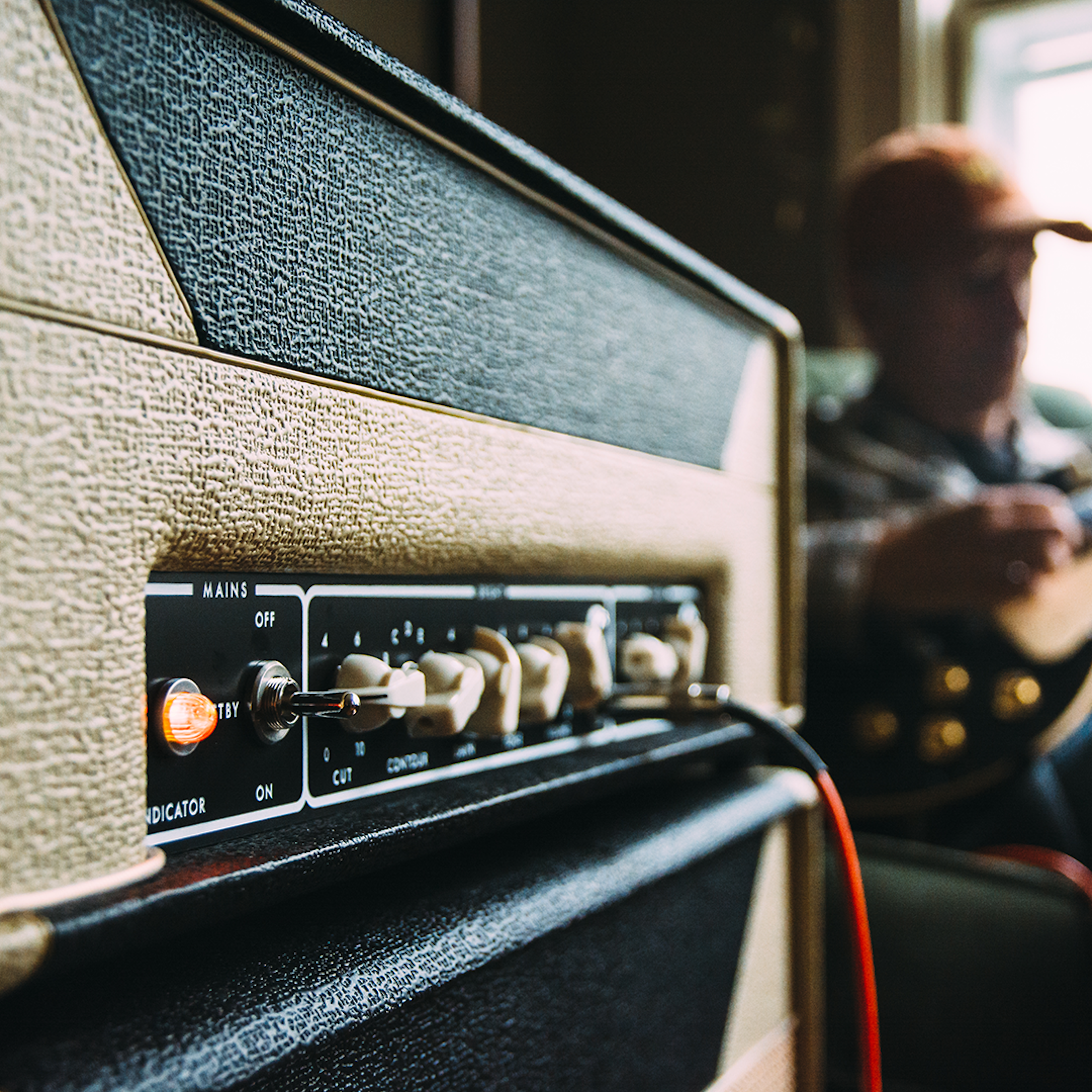 sitting on some awesome guitar amps
